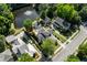Aerial view of houses in a beautiful neighborhood with a pond and mature trees at 4009 E Amy Ln, Johns Island, SC 29455