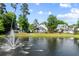 Aerial community view featuring pond with fountain and beautiful homes at 4009 E Amy Ln, Johns Island, SC 29455