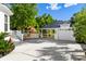 Backyard showcasing garage with covered patio and a wooden playground at 4009 E Amy Ln, Johns Island, SC 29455