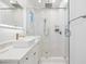 Modern bathroom features a walk-in shower, marble countertop, and square vessel sink with a gold faucet at 4009 E Amy Ln, Johns Island, SC 29455