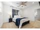 Bedroom with carpet, neutral walls, ceiling fan, and white bed with blue throw at 4009 E Amy Ln, Johns Island, SC 29455