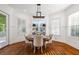 Charming dining area with wainscoting, wood floors, and bright windows at 4009 E Amy Ln, Johns Island, SC 29455