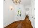 Bright foyer features hardwood floors, statement lighting and stylish doors at 4009 E Amy Ln, Johns Island, SC 29455