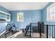 Home gym featuring blue walls, a window, and workout equipment at 4009 E Amy Ln, Johns Island, SC 29455