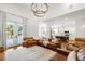 Open concept living area with hardwood floors, comfortable seating, and natural light at 4009 E Amy Ln, Johns Island, SC 29455