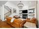Inviting living room with leather seating, fireplace, and custom built-ins at 4009 E Amy Ln, Johns Island, SC 29455