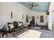 Expansive porch with ceiling fan and ample seating for relaxing or entertaining at 4009 E Amy Ln, Johns Island, SC 29455