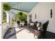 Inviting front porch features black leather furniture and outdoor living space at 4009 E Amy Ln, Johns Island, SC 29455