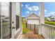 Backyard view from the porch showcases the garage and pond at 4129 Maidstone Dr, Mount Pleasant, SC 29466