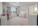 Bright Bedroom features carpet, a crib, natural light, and modern decor at 4129 Maidstone Dr, Mount Pleasant, SC 29466