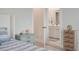 Bright bedroom with walk-in bathroom features carpet and blue striped bedding at 4129 Maidstone Dr, Mount Pleasant, SC 29466