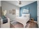Well-lit bedroom with a light quilt, an area rug, and modern décor at 4129 Maidstone Dr, Mount Pleasant, SC 29466