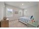 Bright bedroom features carpet, natural light, and blue striped bedding at 4129 Maidstone Dr, Mount Pleasant, SC 29466