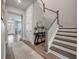 Welcoming entryway and staircase adorned with stylish décor and hardwood flooring at 4129 Maidstone Dr, Mount Pleasant, SC 29466
