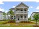 Charming two-story home featuring a double porch, well-maintained landscaping, and inviting curb appeal at 4129 Maidstone Dr, Mount Pleasant, SC 29466