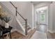 Inviting foyer with light hardwood flooring, a staircase, and views to the entryway at 4129 Maidstone Dr, Mount Pleasant, SC 29466