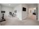 Spacious home office or bonus room with plush carpet and a tv for workouts at 4129 Maidstone Dr, Mount Pleasant, SC 29466