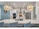 Island with quartz countertops, pendant lights, stainless steel appliances and plenty of white cabinet space at 4129 Maidstone Dr, Mount Pleasant, SC 29466