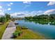 Scenic view of the lake from the property with lush green surroundings and a well-maintained walkway at 4129 Maidstone Dr, Mount Pleasant, SC 29466