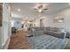 Spacious living room with a large sectional sofa, open to kitchen and dining area, with lots of natural light at 4129 Maidstone Dr, Mount Pleasant, SC 29466