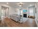 Cozy living room features hardwood floors and a fireplace, perfect for relaxation at 4129 Maidstone Dr, Mount Pleasant, SC 29466