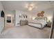 Open main bedroom with neutral carpeting, large windows, and decorative lighting at 4129 Maidstone Dr, Mount Pleasant, SC 29466