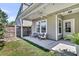 Relaxing back patio with outdoor seating and a ceiling fan, perfect for entertaining at 4235 Scharite St, Charleston, SC 29414