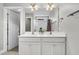 Bathroom with a double sink vanity, large mirror, and a shower-tub combination at 4235 Scharite St, Charleston, SC 29414
