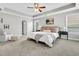 Spacious primary bedroom with tray ceiling, plush carpet, and abundant natural light at 4235 Scharite St, Charleston, SC 29414