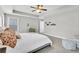 Comfortable bedroom with carpet, tray ceiling, and a ceiling fan for year-round comfort at 4235 Scharite St, Charleston, SC 29414