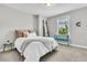 Cozy bedroom featuring neutral walls, plush carpeting, and a bright window for natural light at 4235 Scharite St, Charleston, SC 29414
