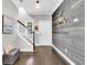 Chic entryway featuring wood-look accent wall, staircase, and an inviting ambiance at 4235 Scharite St, Charleston, SC 29414