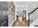 Stylish entryway with wood-paneled accent wall, hardwood floors, and staircase leading to the upper level at 4235 Scharite St, Charleston, SC 29414