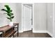 Well-lit hallway with hardwood floors and a stylish console table at 4235 Scharite St, Charleston, SC 29414