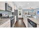 Beautiful kitchen with stainless steel appliances, white cabinets, granite counters, and open layout at 4235 Scharite St, Charleston, SC 29414