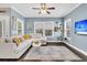 Bright and airy living room with hardwood floors, modern decor, and large windows at 4235 Scharite St, Charleston, SC 29414