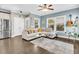 Comfortable living room with hardwood floors, a ceiling fan, and plenty of natural light at 4235 Scharite St, Charleston, SC 29414