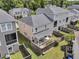 Aerial view of a well-maintained backyard with a patio, privacy fence, and lush greenery at 4235 Scharite St, Charleston, SC 29414