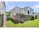 Backyard with a wooden privacy fence, featuring a covered patio with outdoor seating at 4235 Scharite St, Charleston, SC 29414