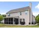 Rear exterior of home with screened porch and spacious backyard at 428 Cabrill Dr, Charleston, SC 29414