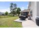 Spacious backyard with a grill on a concrete patio and a manicured lawn at 428 Cabrill Dr, Charleston, SC 29414