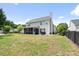 Spacious backyard featuring a screened porch and well-maintained lawn, perfect for outdoor entertaining at 428 Cabrill Dr, Charleston, SC 29414