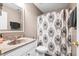Neutral bathroom features a decorative shower curtain, modern fixtures, and a decorative mirror at 428 Cabrill Dr, Charleston, SC 29414