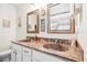 Double vanity in the bathroom features bronze fixtures, framed mirrors, and matching sink basins at 428 Cabrill Dr, Charleston, SC 29414