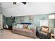 Bonus room offers a comfortable couch, chair, and exercise equipment at 428 Cabrill Dr, Charleston, SC 29414
