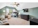 Comfortable home office with large window, tv, desk, couch, and great natural light at 428 Cabrill Dr, Charleston, SC 29414