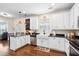 Open kitchen with white cabinetry, stainless steel appliances, an island and dark countertops at 428 Cabrill Dr, Charleston, SC 29414