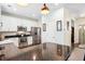 Bright kitchen featuring white cabinets, stainless steel appliances, and a large island with stone countertops at 428 Cabrill Dr, Charleston, SC 29414