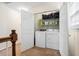 Upstairs laundry closet with washer and dryer; additional storage shelving included at 428 Cabrill Dr, Charleston, SC 29414