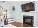 Stylish living room featuring a fireplace, mounted TV, and access to a staircase at 428 Cabrill Dr, Charleston, SC 29414
